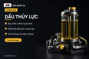 Dầu Thủy Lực — Bình chứa dầu thủy lực với các ống và khớp nối kim loại.